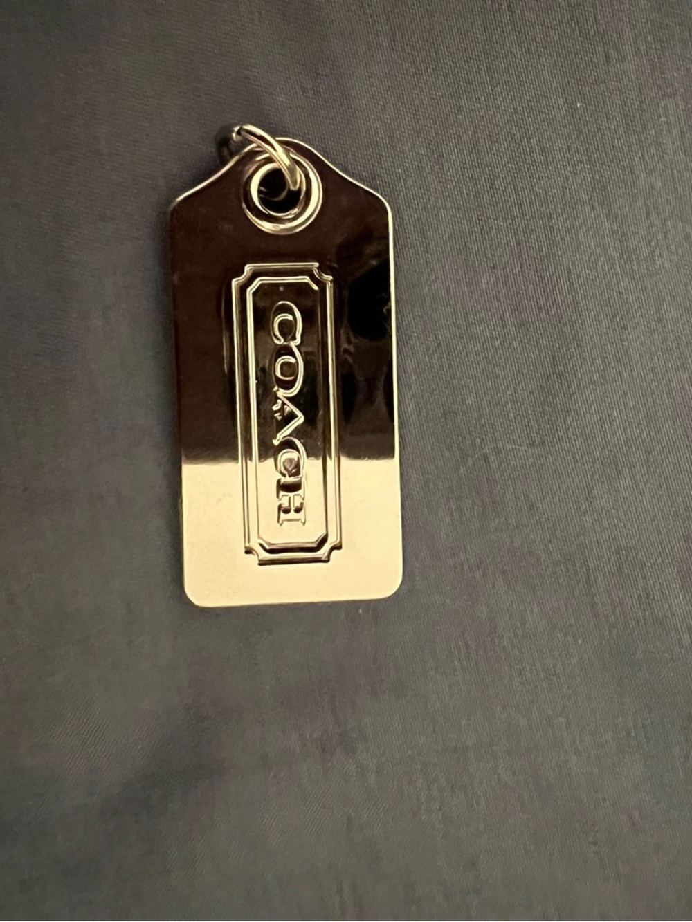 Coach  sliver tone Logo hang tag